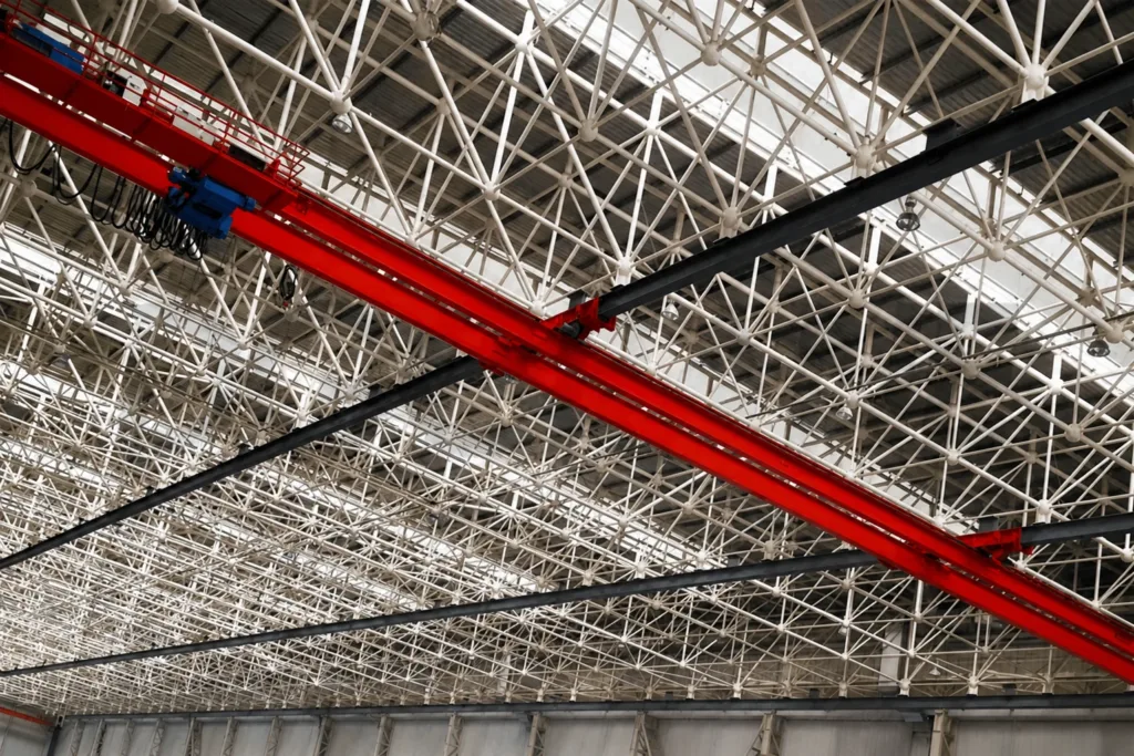 Long suspended bridge supported at several overhead runway beams