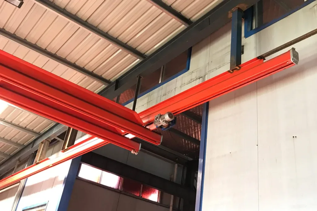 Local lifting equipment serving an industrial machine
