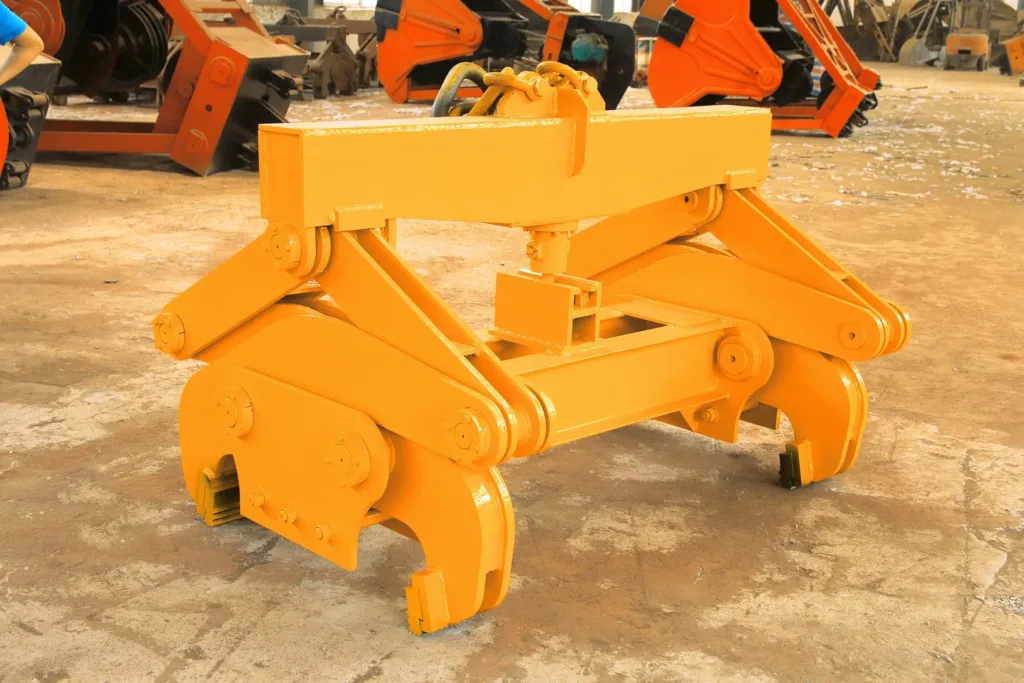 Mechanical pressure tongs showing opposing jaws in a workshop