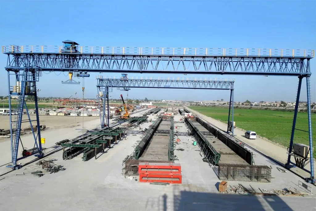 Twin precast gantry cranes spanning a bridge-beam casting yard