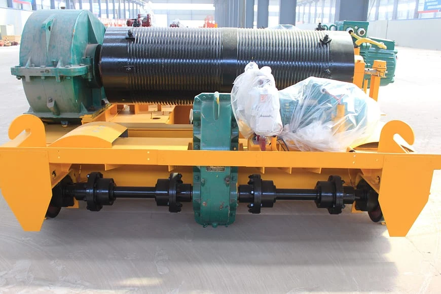 Real QD open-hoist trolley showing the rope drum, gearbox, drive shaft, frame and wheels