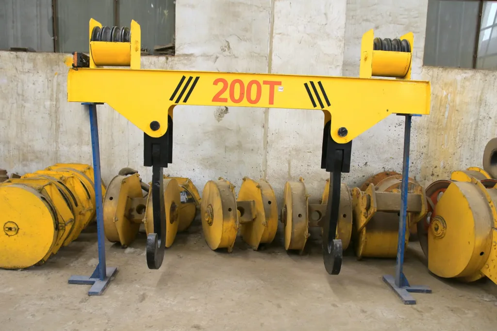 Ladle lifting beam with twin hooks and sheaves on a workshop stand