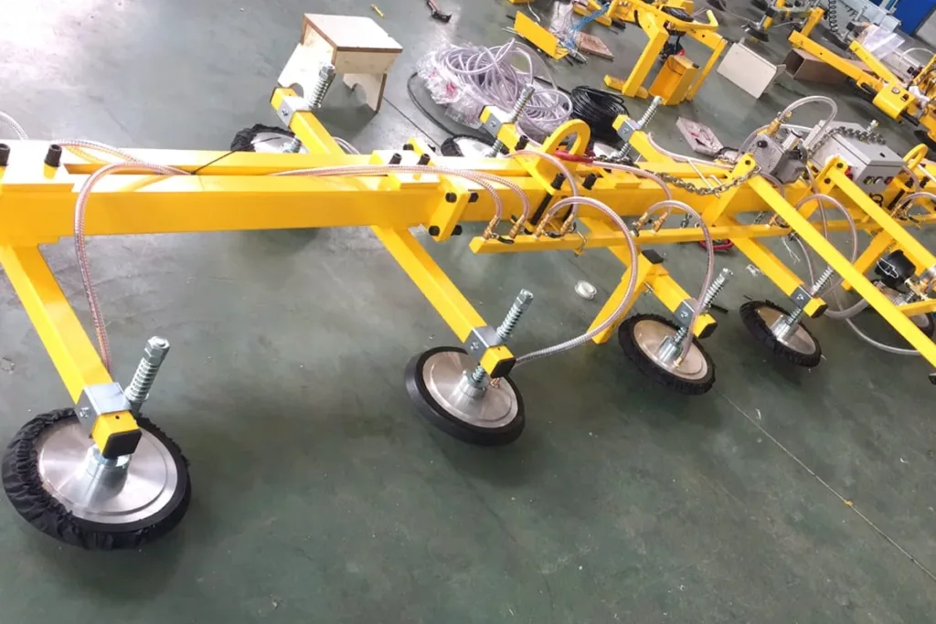 Vacuum lifting frame with multiple suction pads and hoses