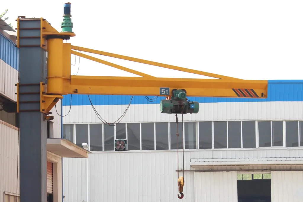 Wall-mounted jib cranes fixed to industrial building columns