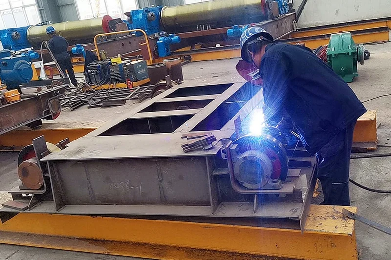 Welding a crane trolley frame in a manufacturing workshop
