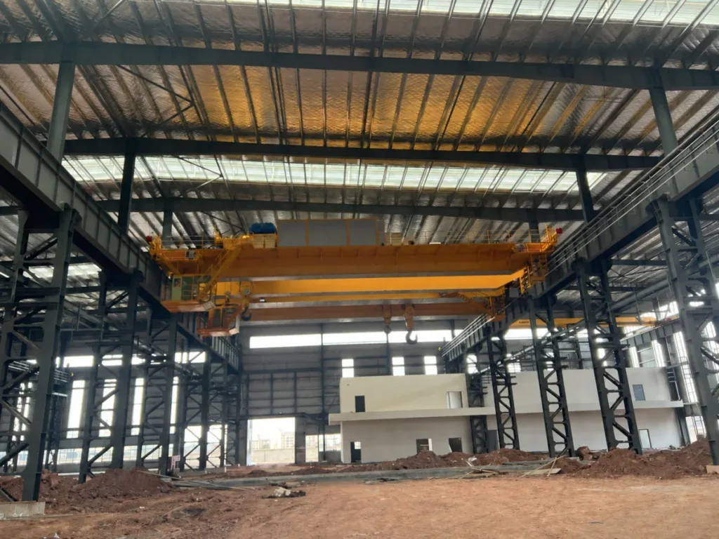 Installed overhead crane in a heat-treatment workshop, shown before production use