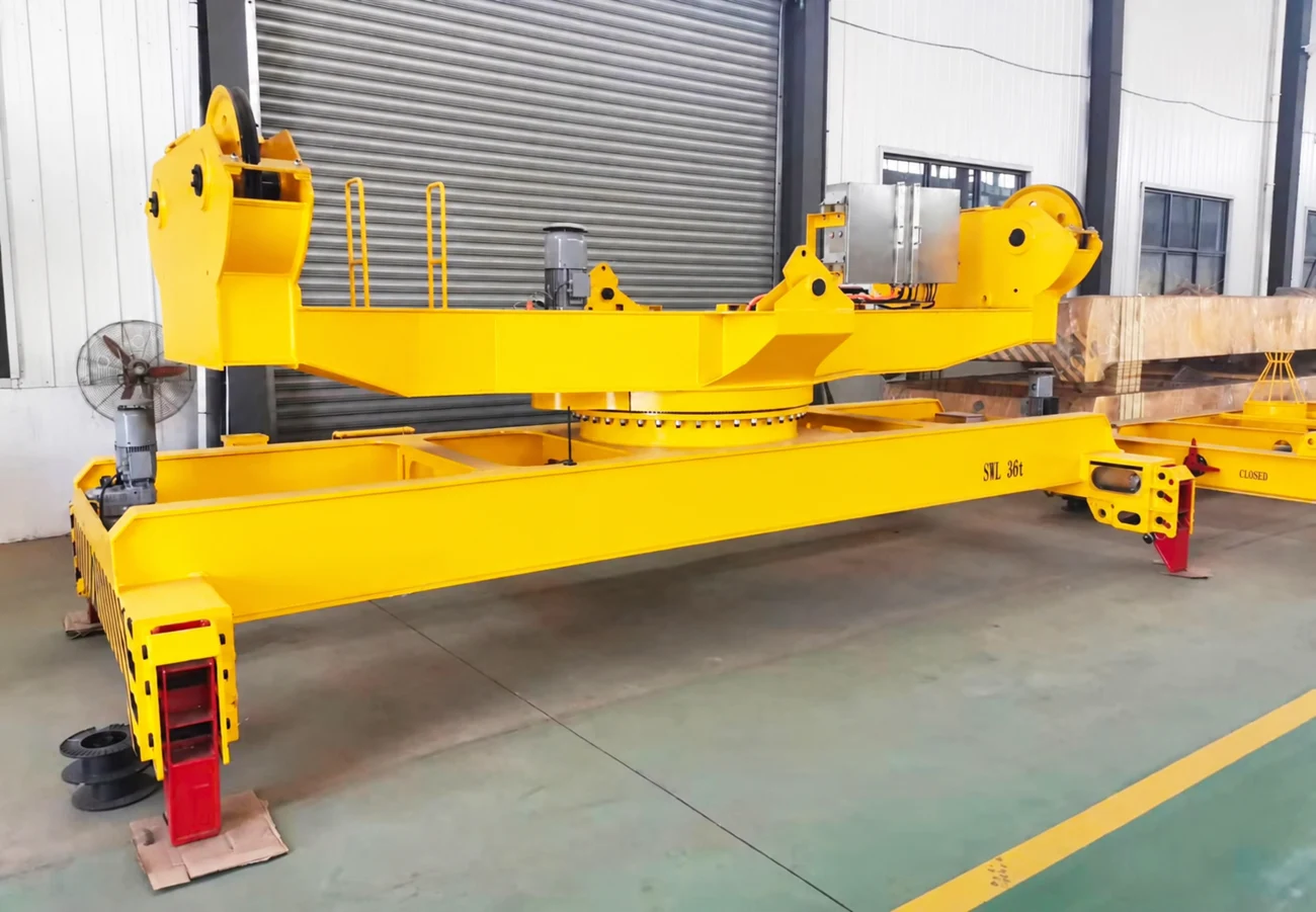 Telescopic container spreader with upper suspension and rotation assembly in a factory