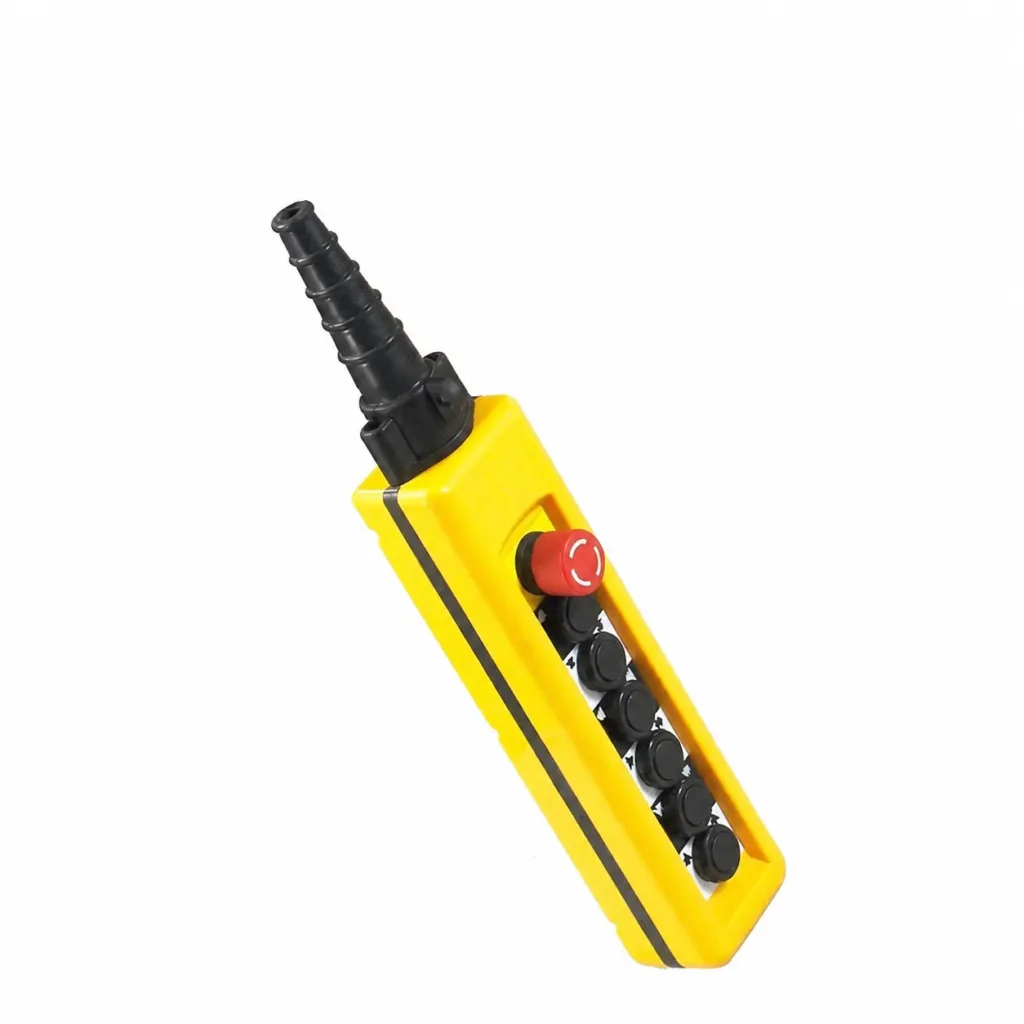 Yellow wired crane pendant with emergency stop and directional pushbuttons