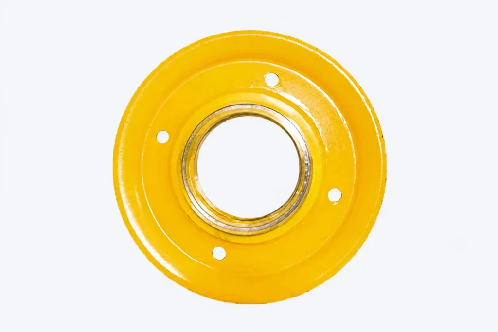 Yellow rope sheave showing its groove, central bore and four holes
