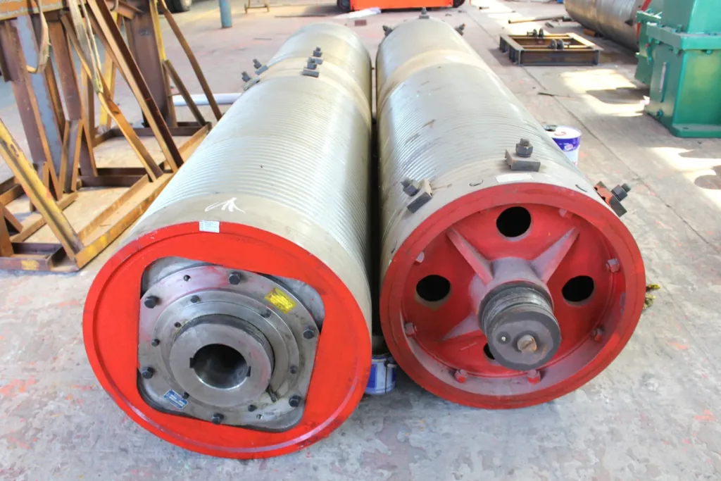 Two rope drum assemblies showing their shafts and end connections