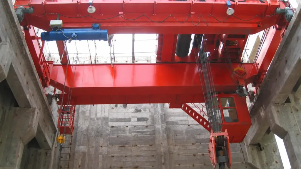 Power-station crane example with large reeved lifting block, smaller auxiliary hoist and access stairs