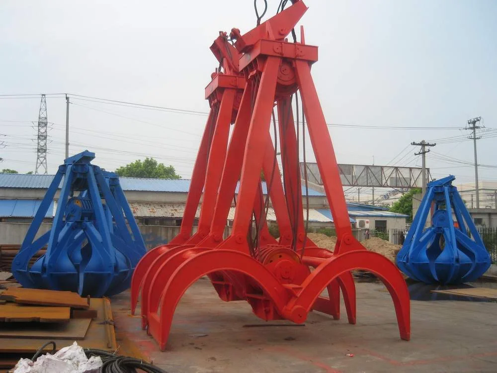 Red timber grab with curved jaws and mechanical rope reeving