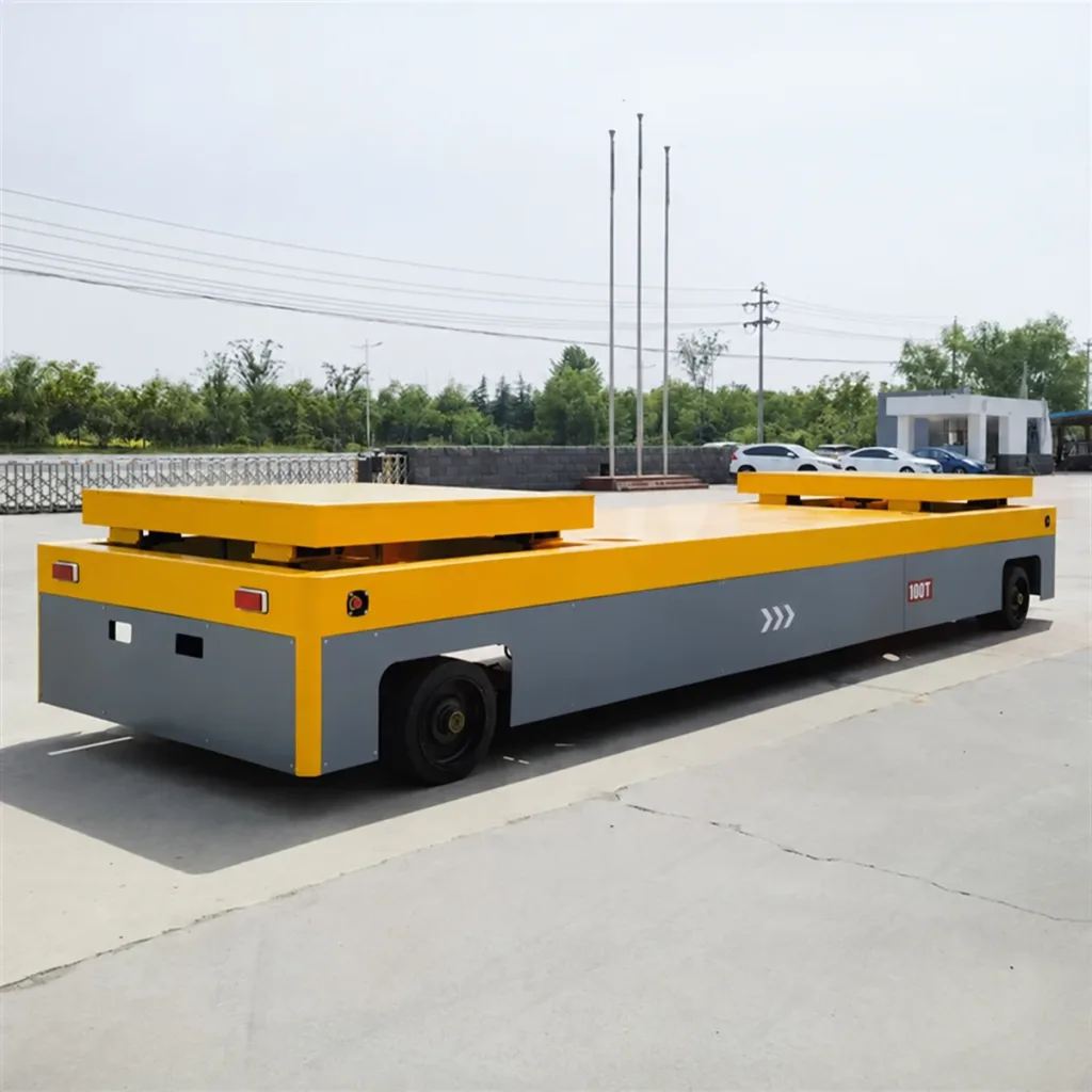 Low-platform heavy-duty transfer cart with box-section chassis and lifting pads at both ends