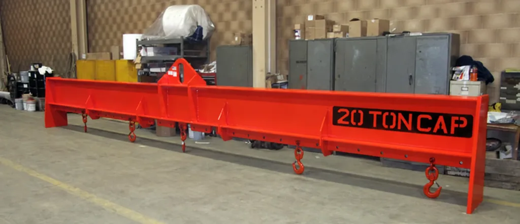 Red adjustable lifting beam with central upper lug and five lower hooks, resting on its stand; marked rating belongs to this example