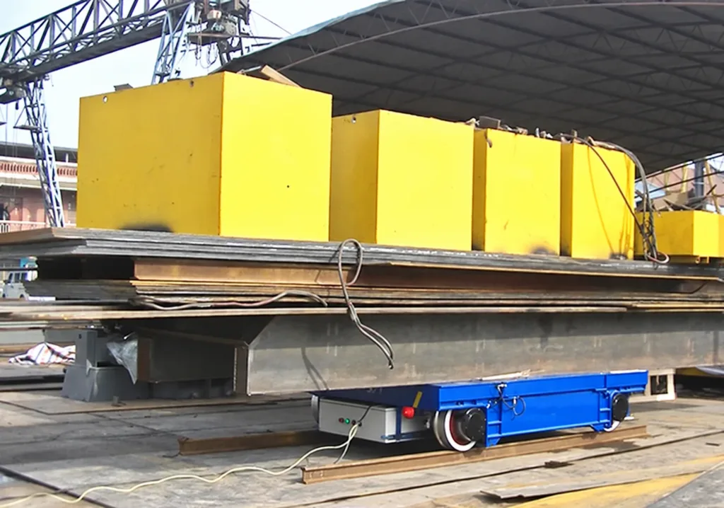 Rail transfer cart carrying steel and ballast blocks during a supplier load test