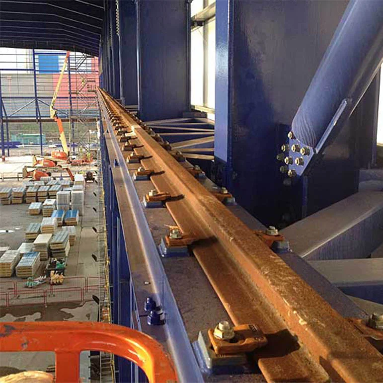 Crane rail and fastenings on a steel runway beam