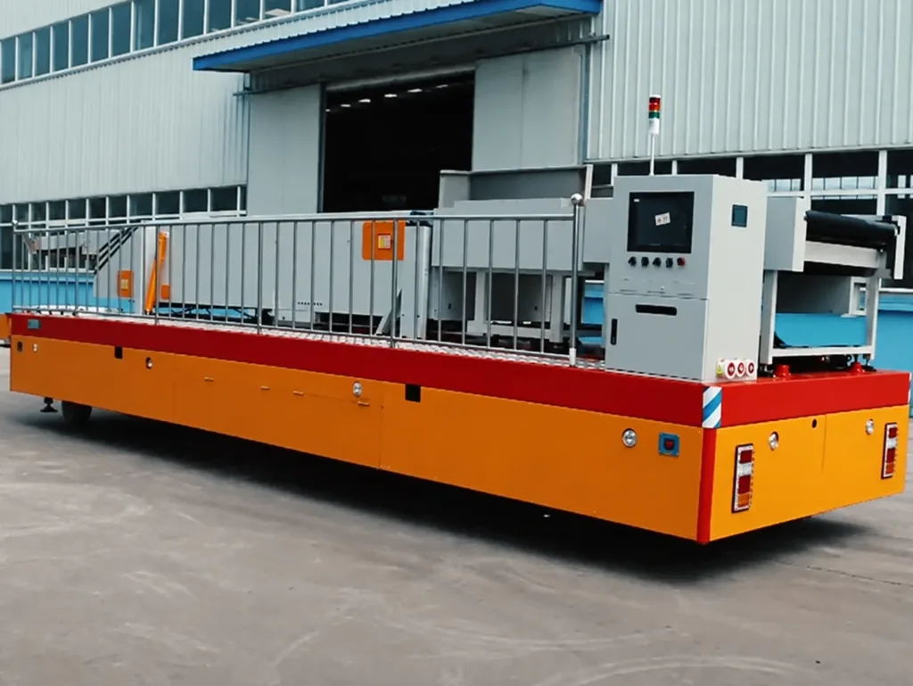 Industrial equipment carried on a long trackless platform with side railings