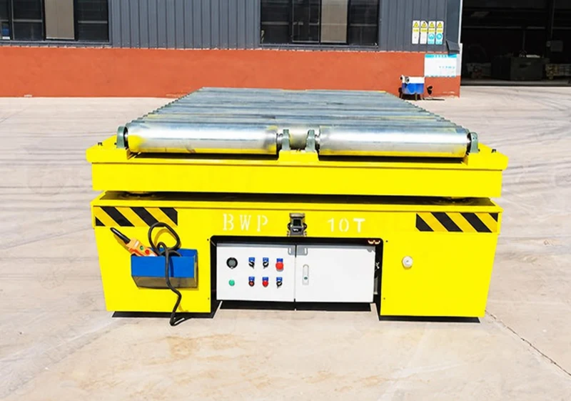 Trackless cart with transverse roller platform, load rating, hazard stripes and pendant control