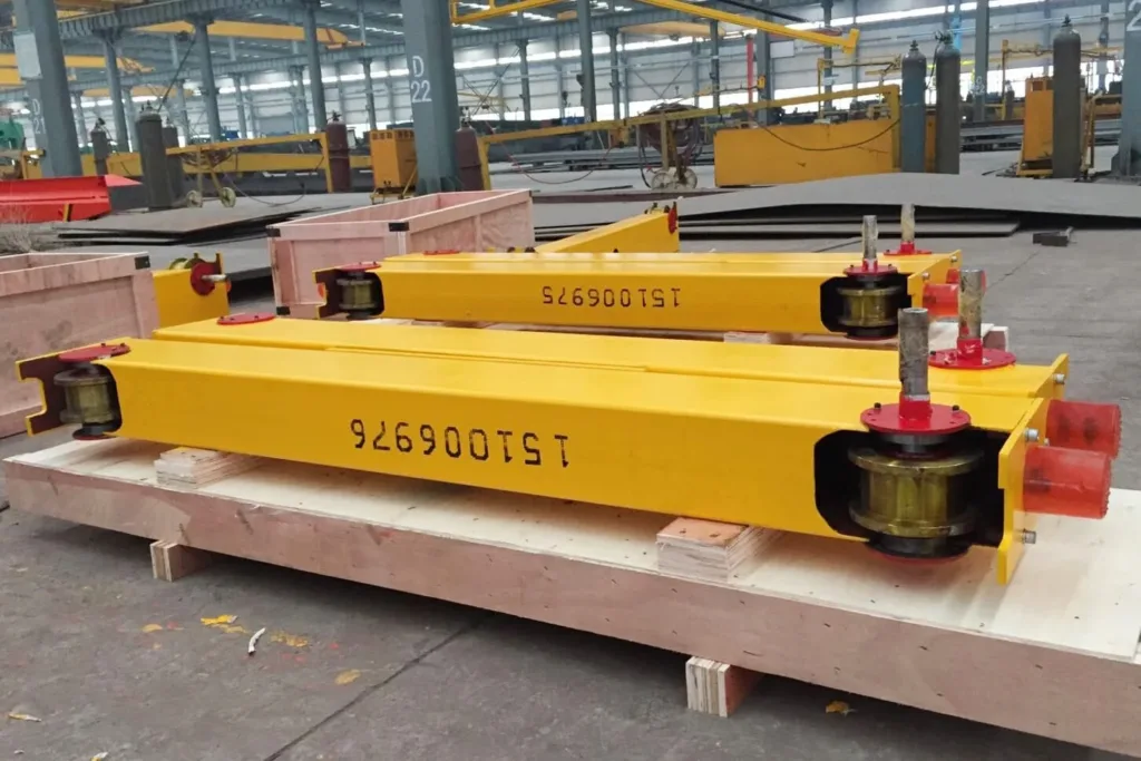 Rail-running end carriages with wheels and connection surfaces prepared for assembly