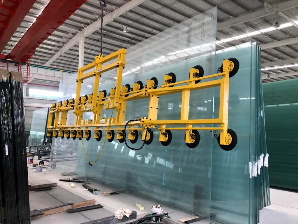 Vacuum glass lifting attachment handling a pane