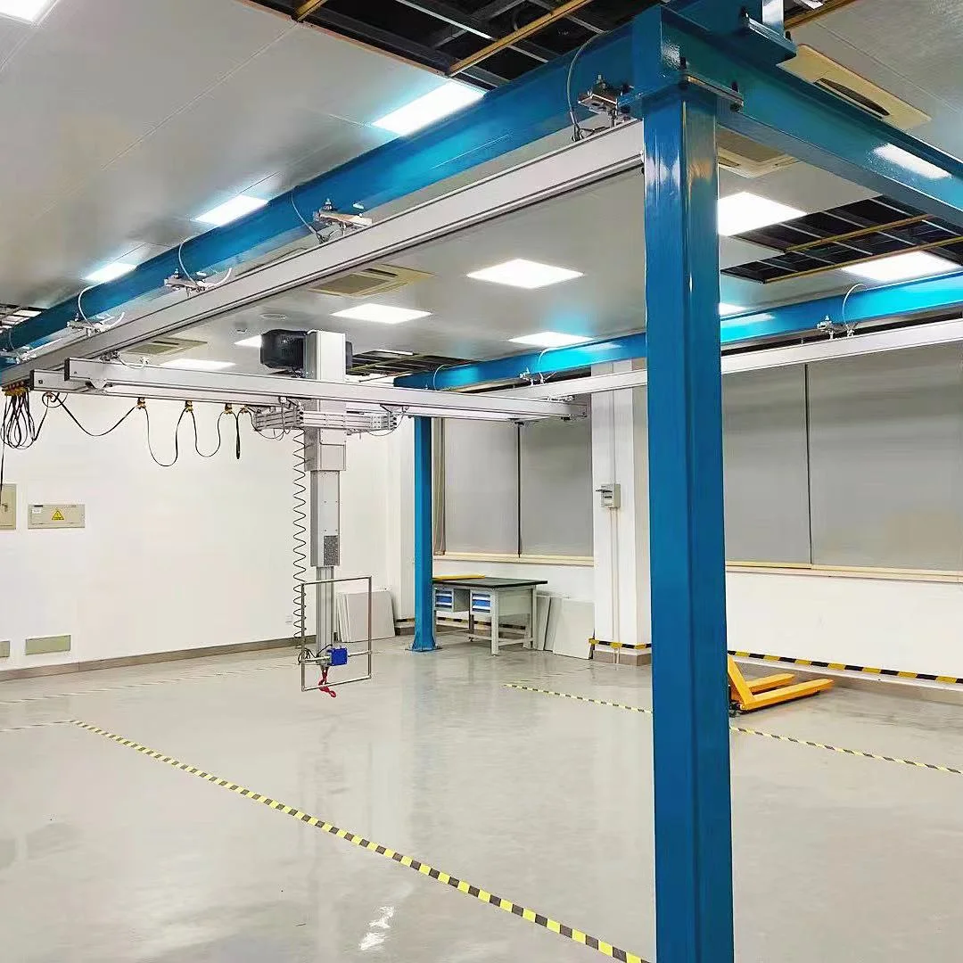 Aluminium bridge and tool-handling arm mounted below a blue freestanding steel frame
